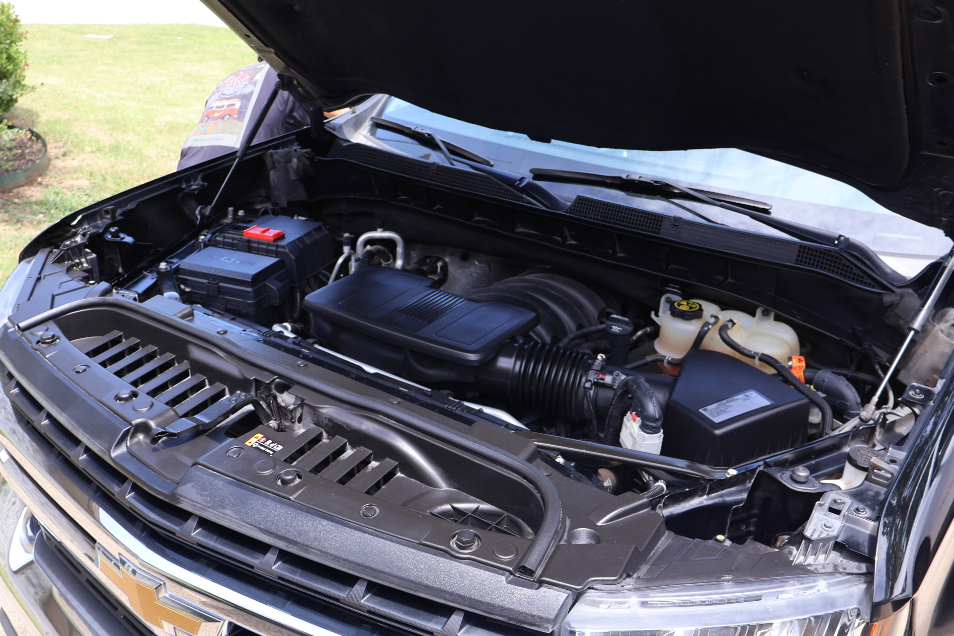 Clean, dressed engine bay after Boulos Detail engine bay detailing